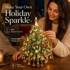 Woman crafting a Christmas Sparkle DIY beaded tree with colorful ornaments, angel topper and warm lights